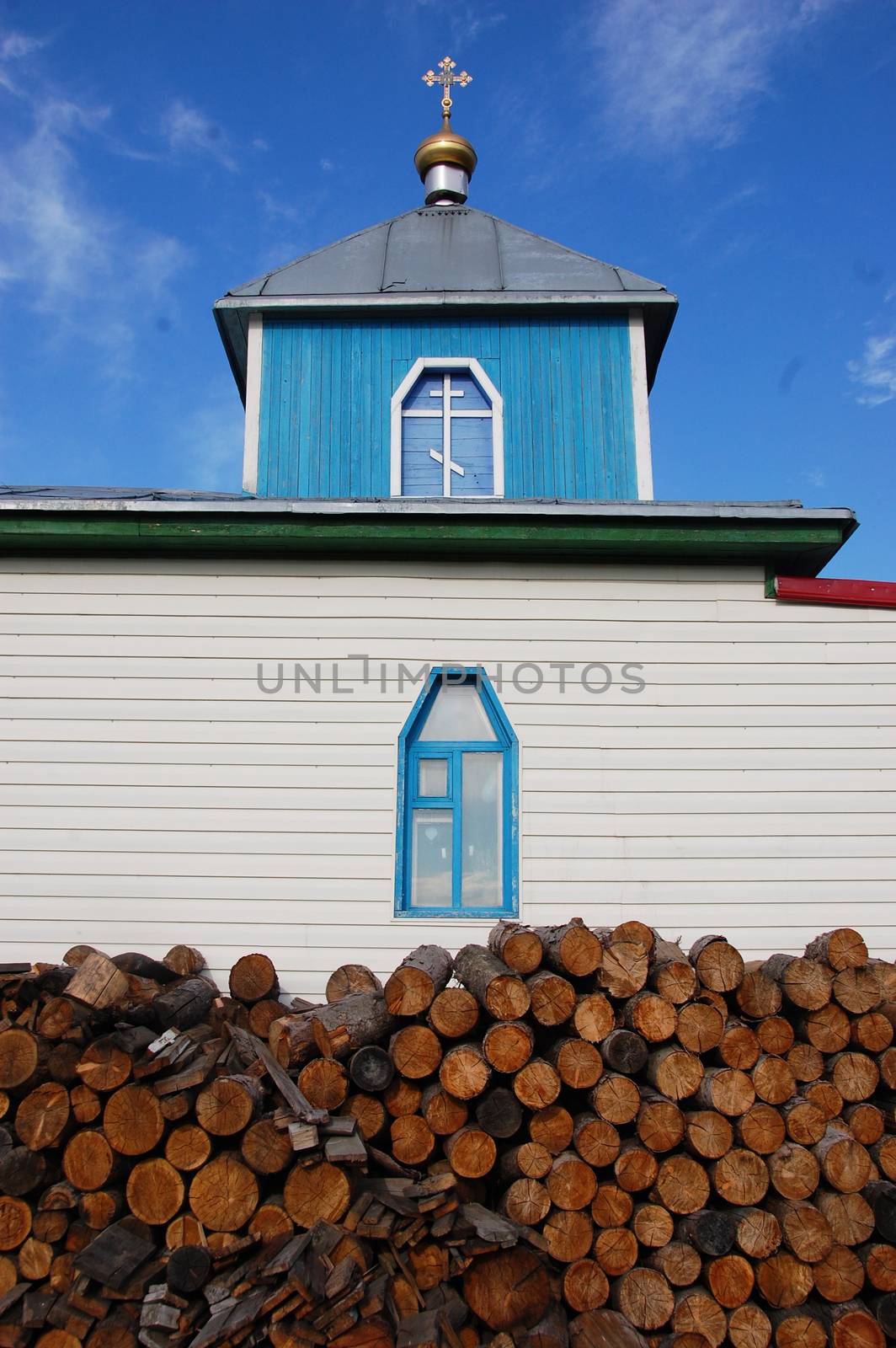 Woodpile at christian church building, Pevek town, Chukotka, Russia