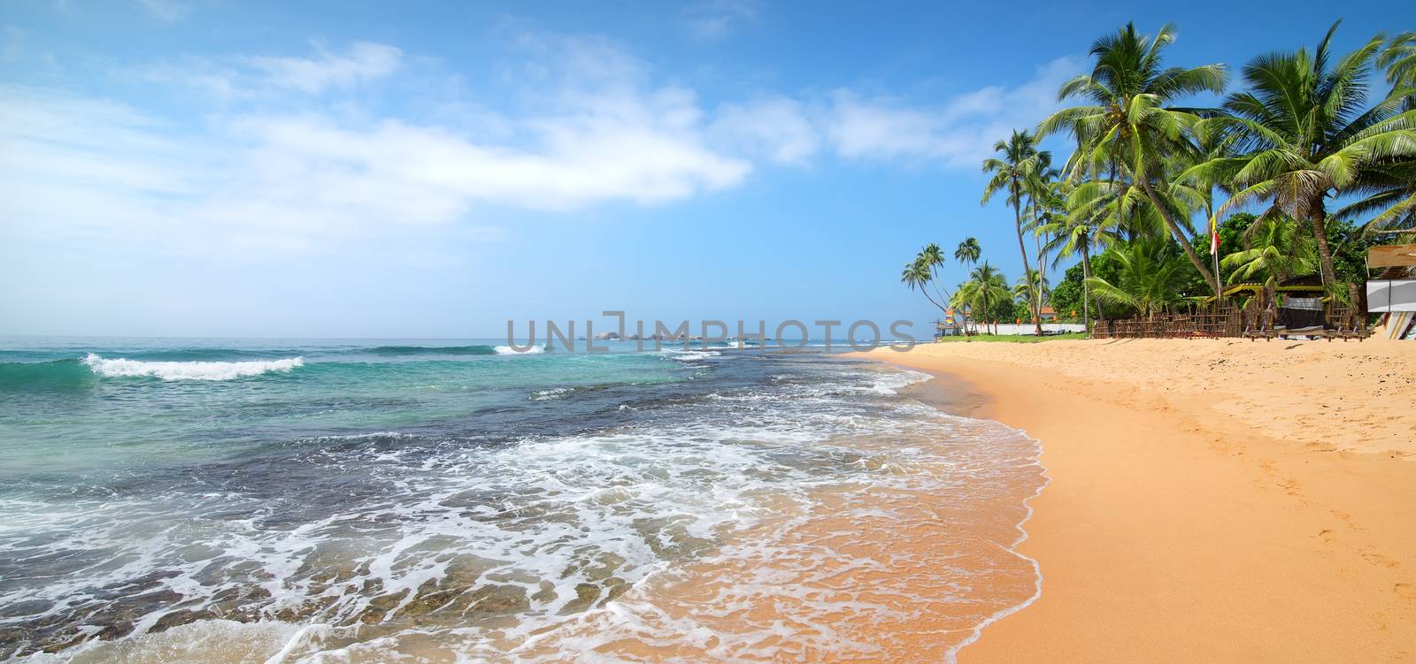 Foamy waves on a beach of Indian ocean