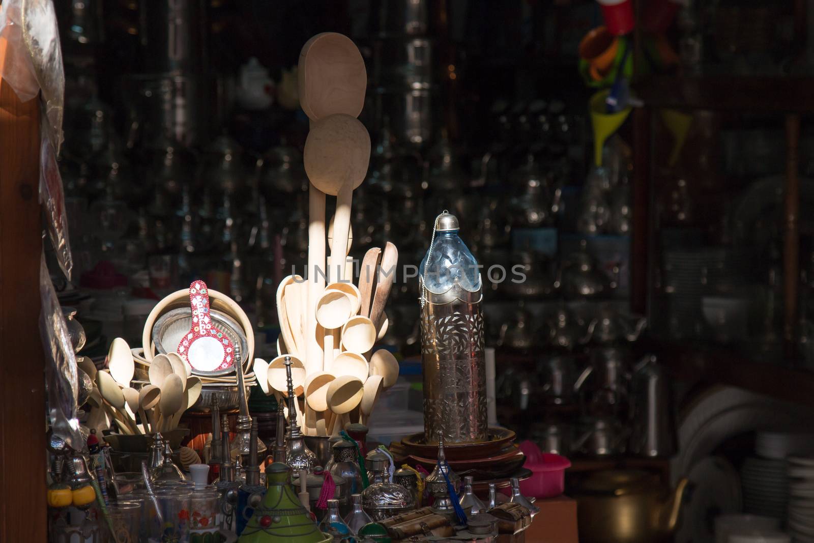 Displayed and by sunshine enlightened souvenirs in a moroccan shop.