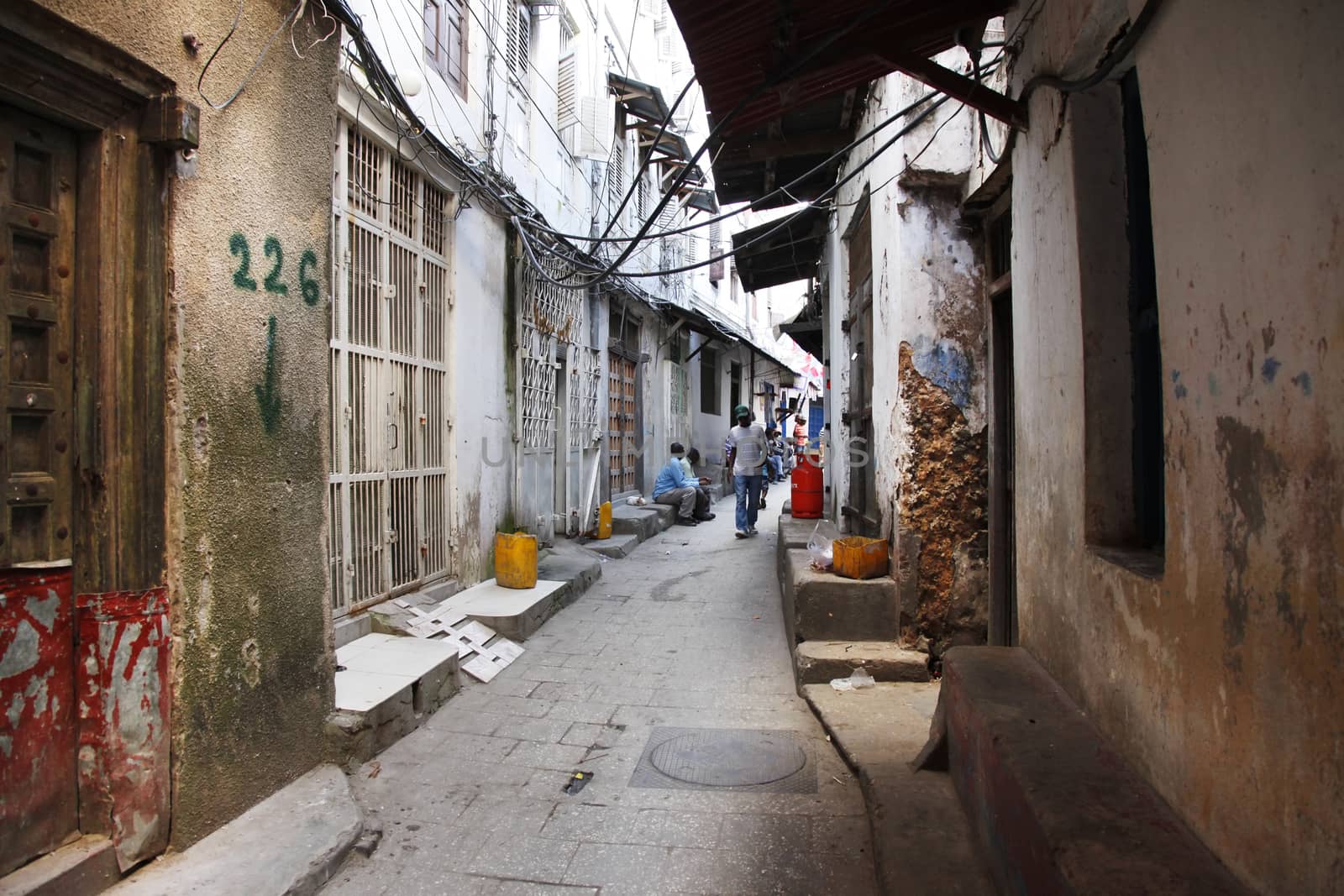 Stone Town, Zanzibar, Tanzania - January 1, 2016: People going about their daily business in Stone Town market, on the island of Zanzibar