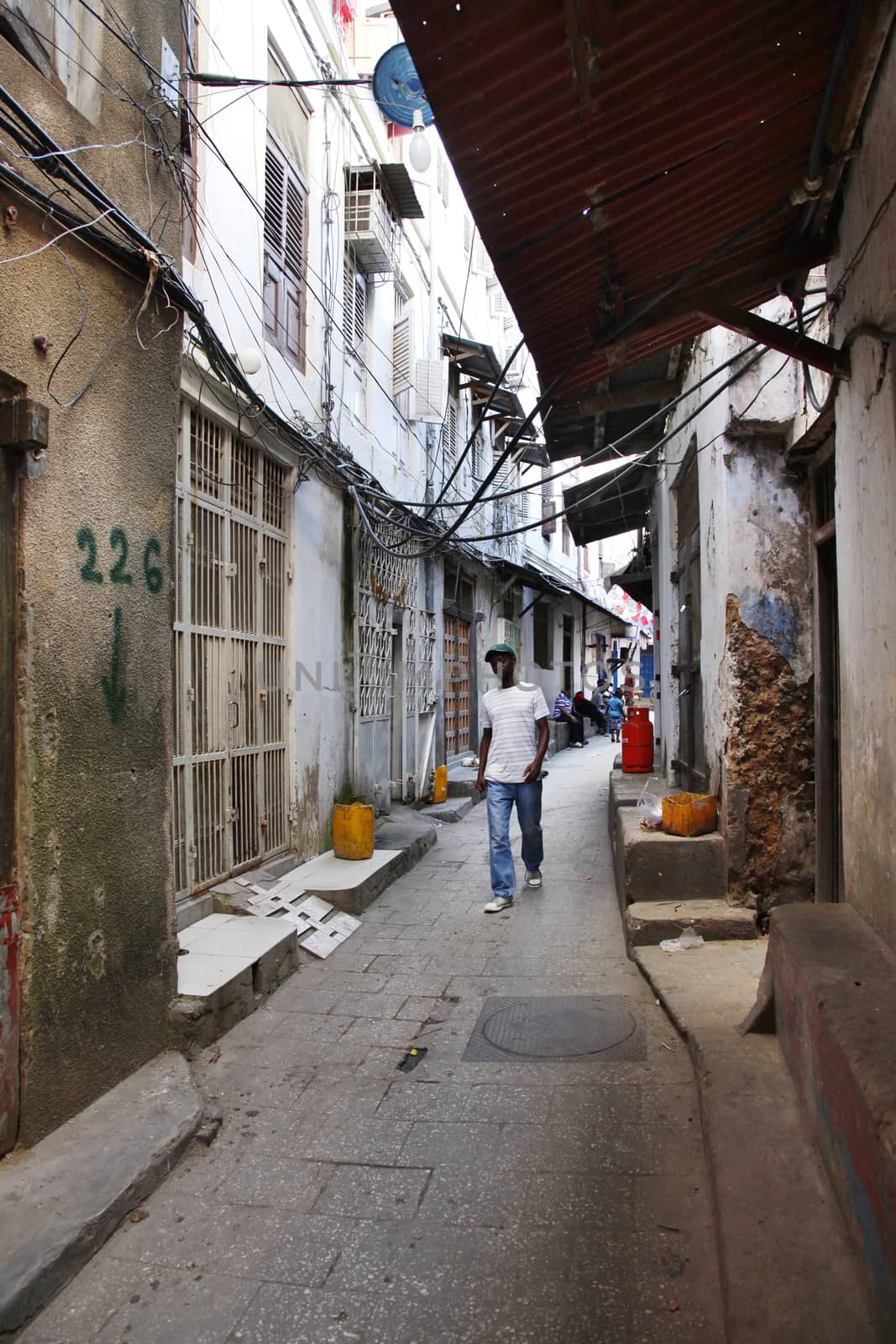 Stone Town, Zanzibar, Tanzania - January 1, 2016: People going about their daily business in Stone Town market, on the island of Zanzibar