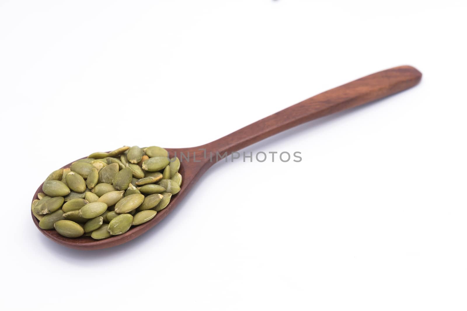 Healthy nutritional Sunflower seeds on wooden spoon