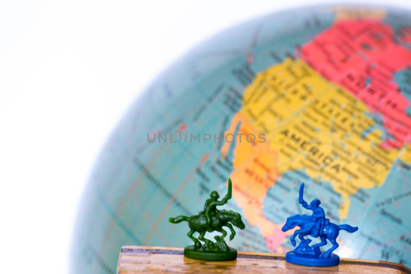 Plastic soldiers in front of a globe