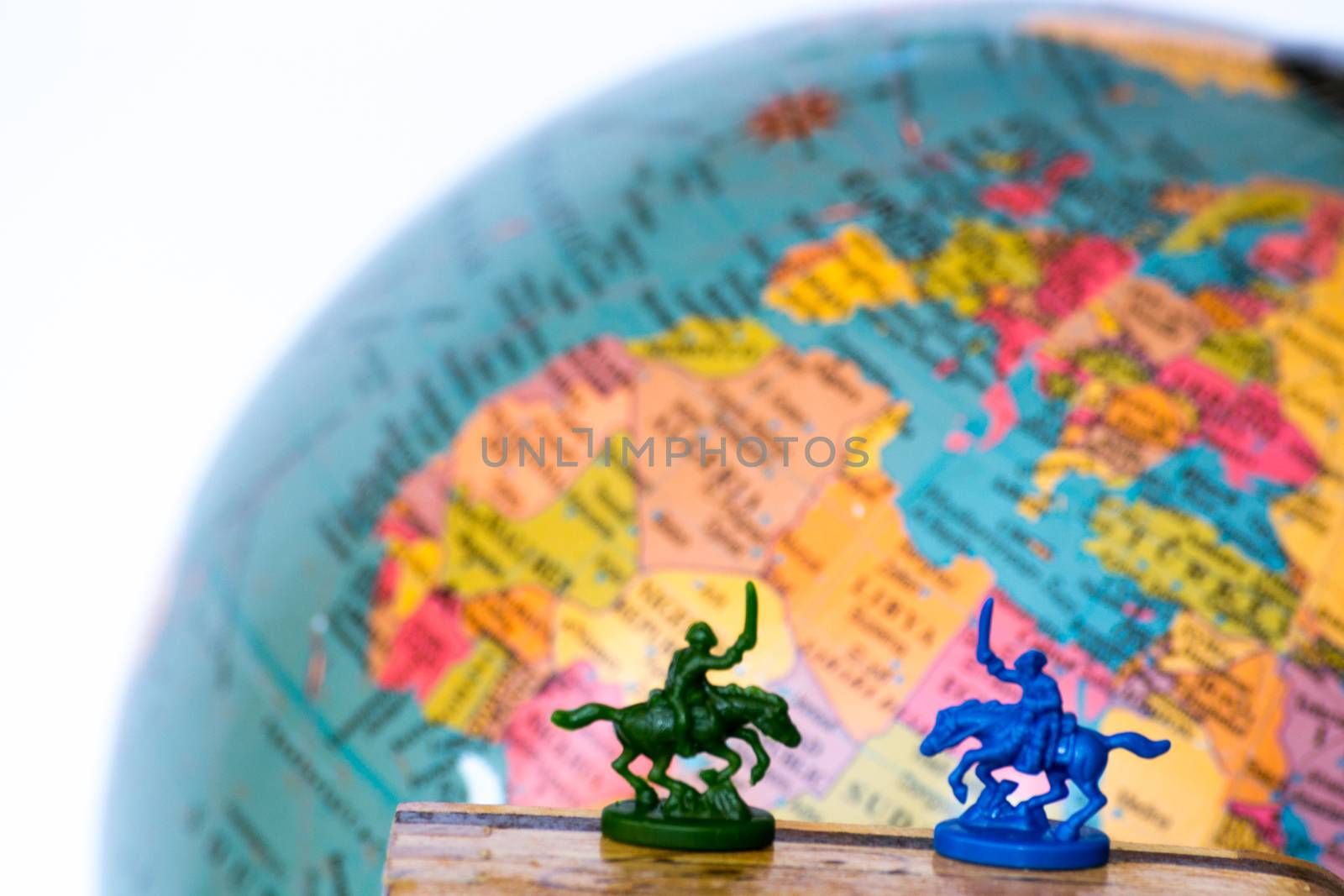 Plastic soldiers in front of a globe