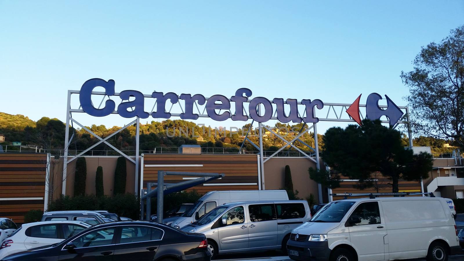 Nice, France - February 13 2016: Sign and Logo above a Carrefour Supermarket in Nice Lingostiere. Carrefour is one of the Largest Supermarket Chain in the World