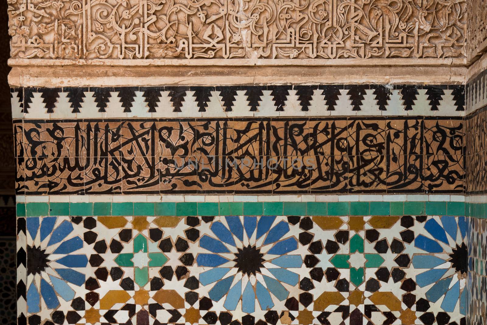 Details of the mosaic with floral pattern and arabic script parts.