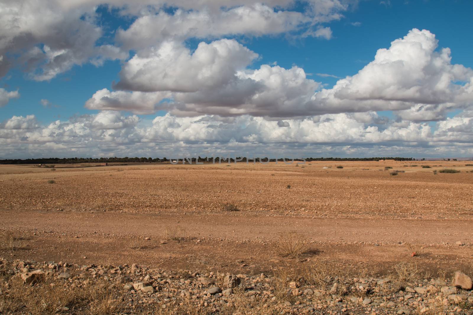 Moroccan nature in the autumn. Empty field ready for the new season. Intense cloudy sky.