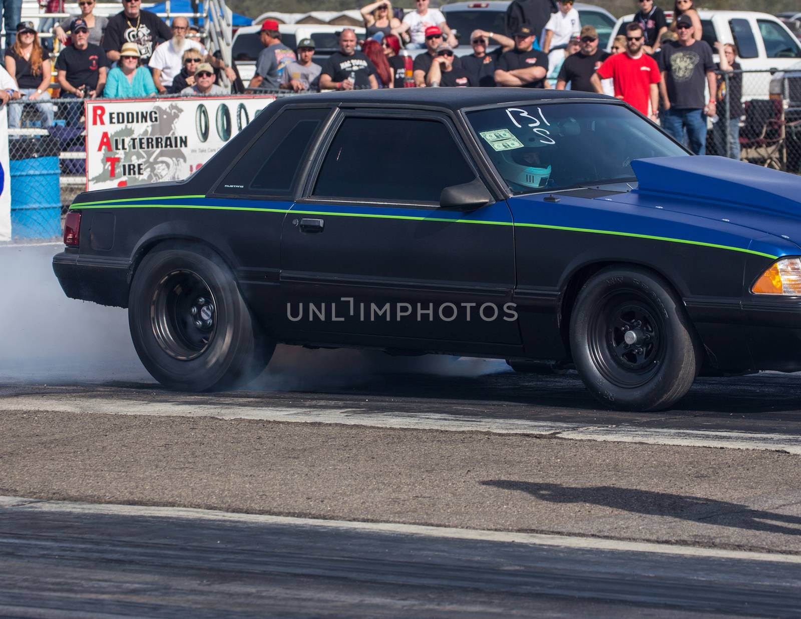Redding, California: A hot rod burns rubber to get better friction for it's tires before a drag race.
Photo taken on: February 13th, 2016