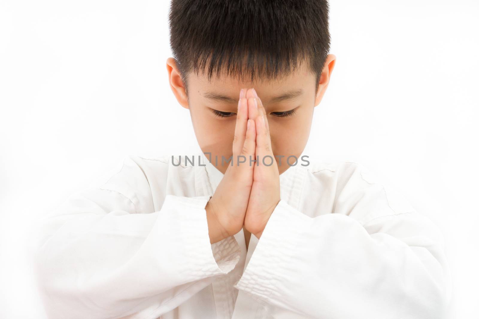 Asian Little Karate Boy in White Kimono on White Background