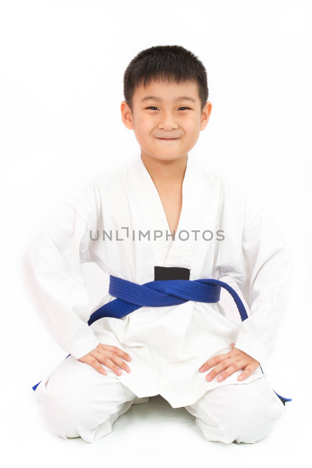 Asian Little Karate Boy in White Kimono on White Background