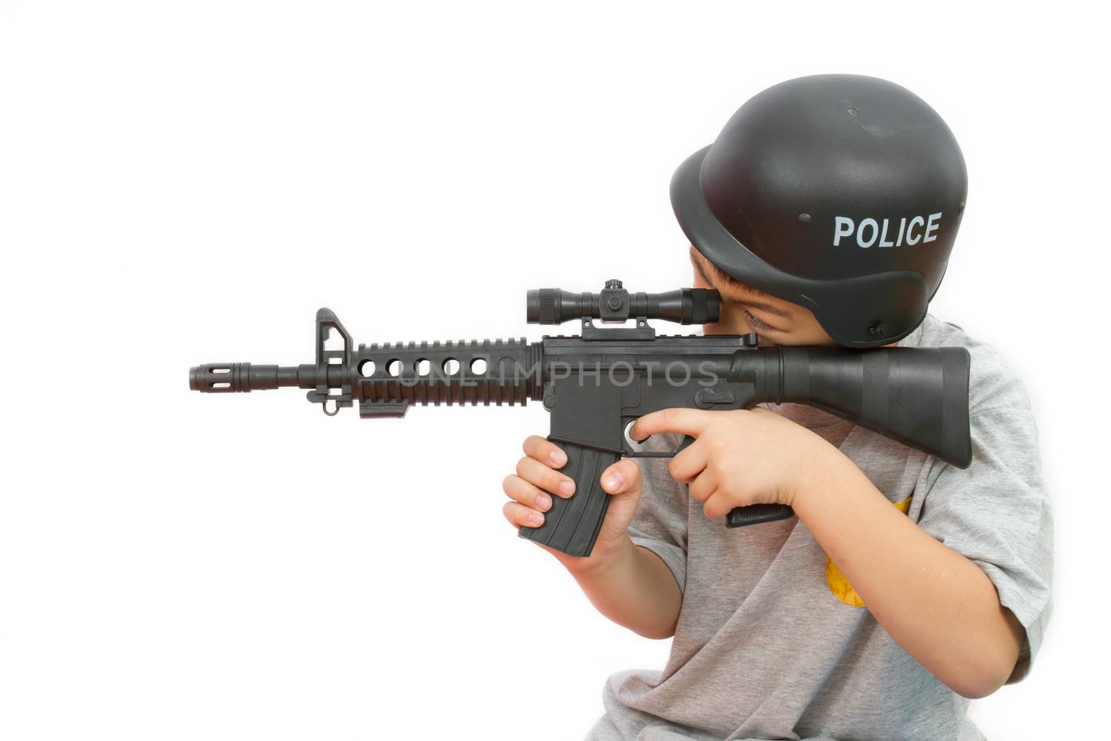 Asian Little Boy Playing Plastic Toy AK47 with Police Helmet by kiankhoon