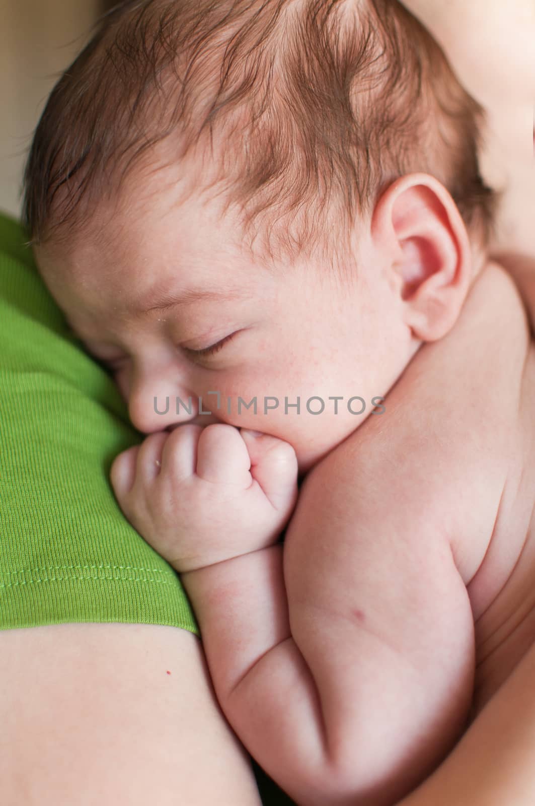 Closeup vertical portrait of the sleeping baby