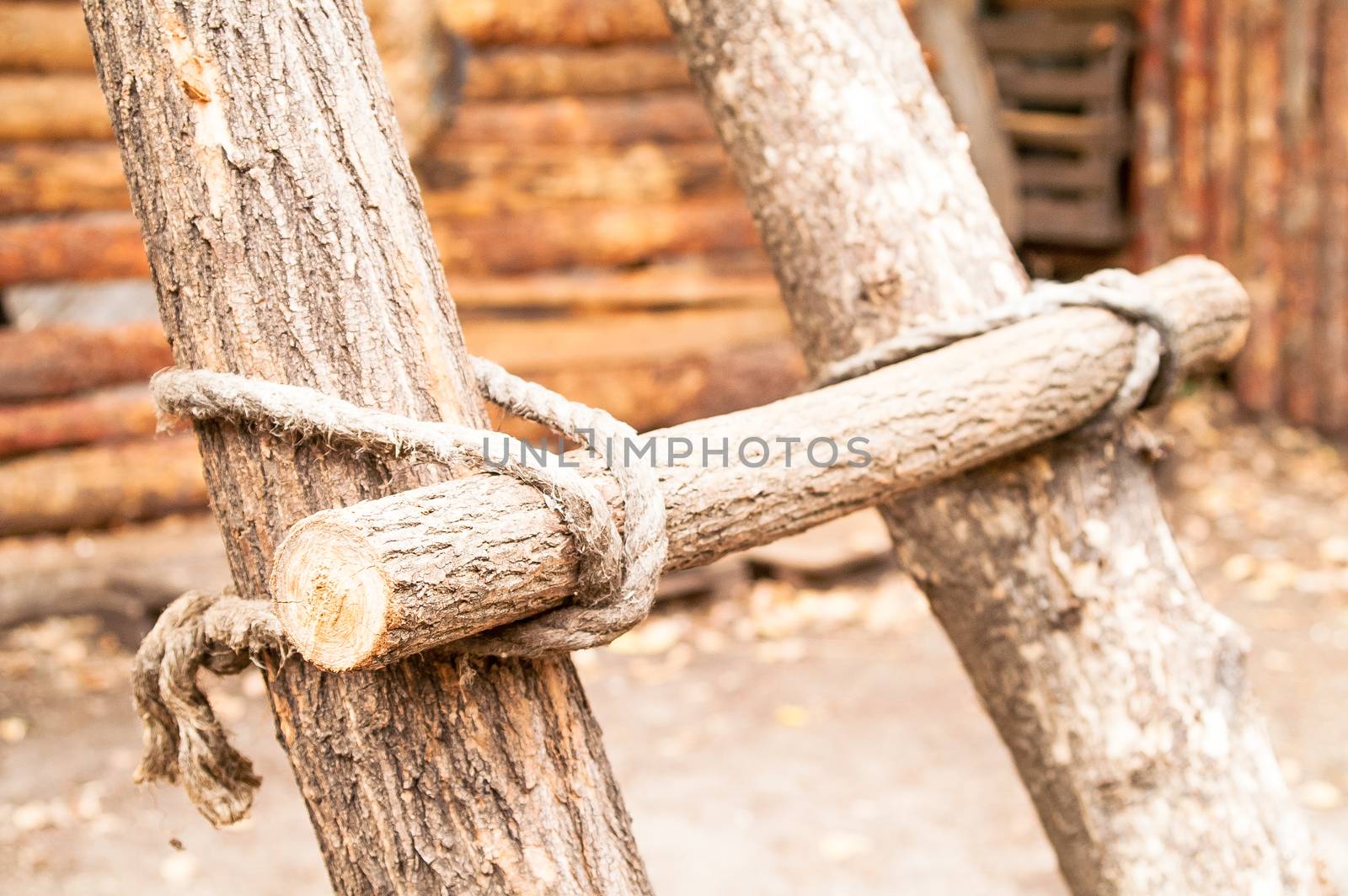 outdoor wooden circular staircase made of logs