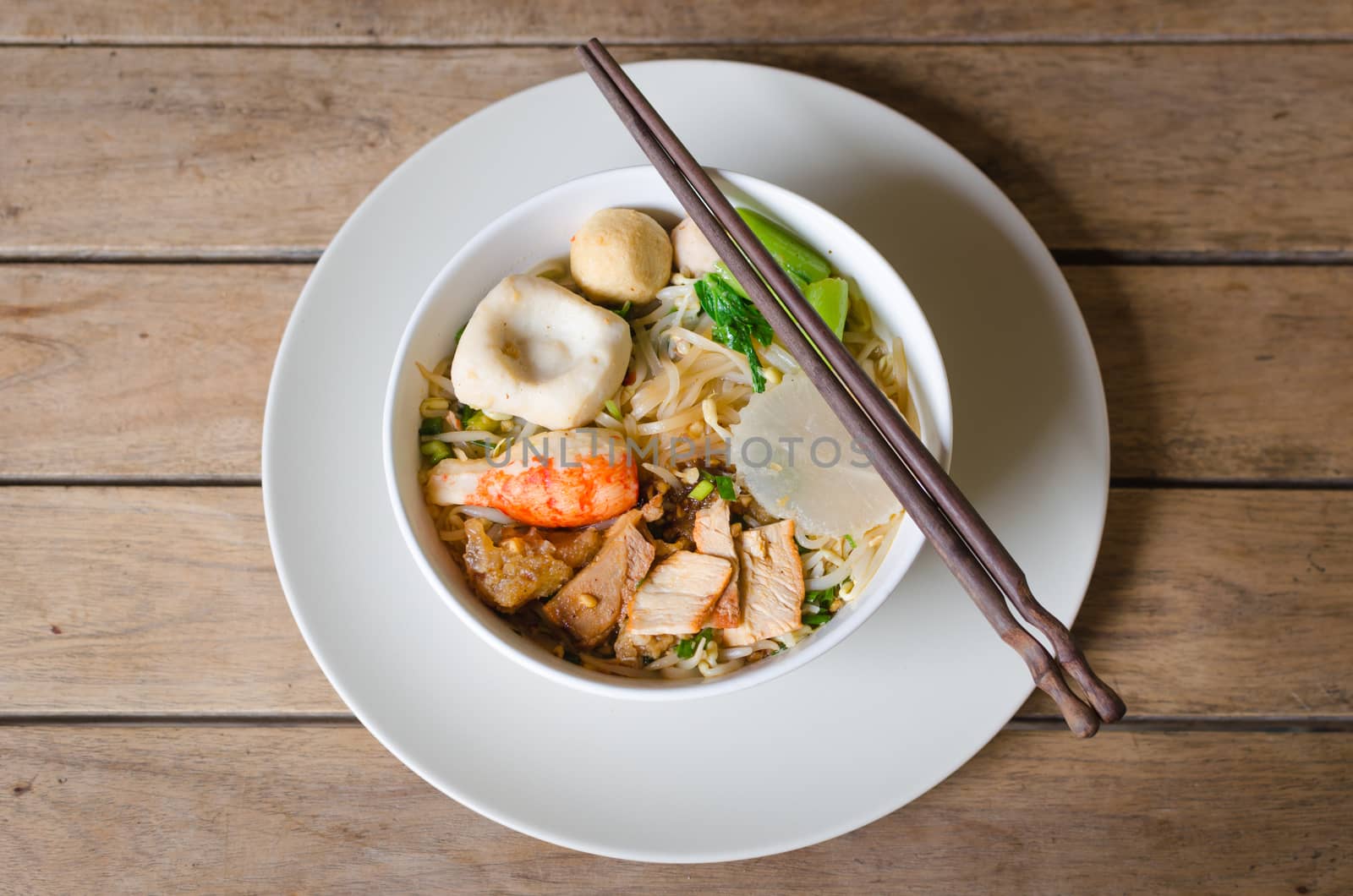 noodle with fish ball and pork is traditional food in Thailand