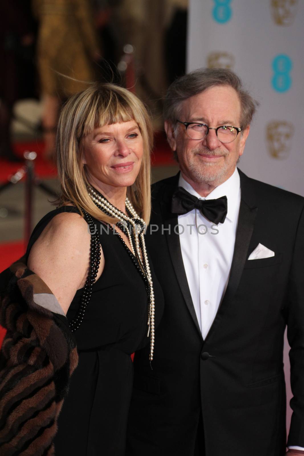 UK, London: American director Steven Spielberg and wife Kate Capshaw pose on the red Carpet at the EE British Academy Film Awards, BAFTA Awards, at the Royal Opera House in London, England, on 14 February 2016. 