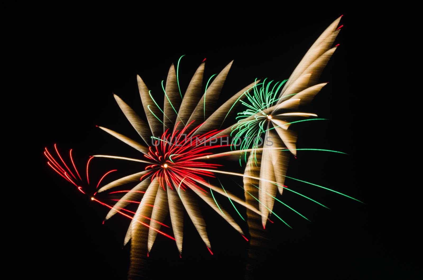 An image of exploding fireworks at night. Represents a celebration.
