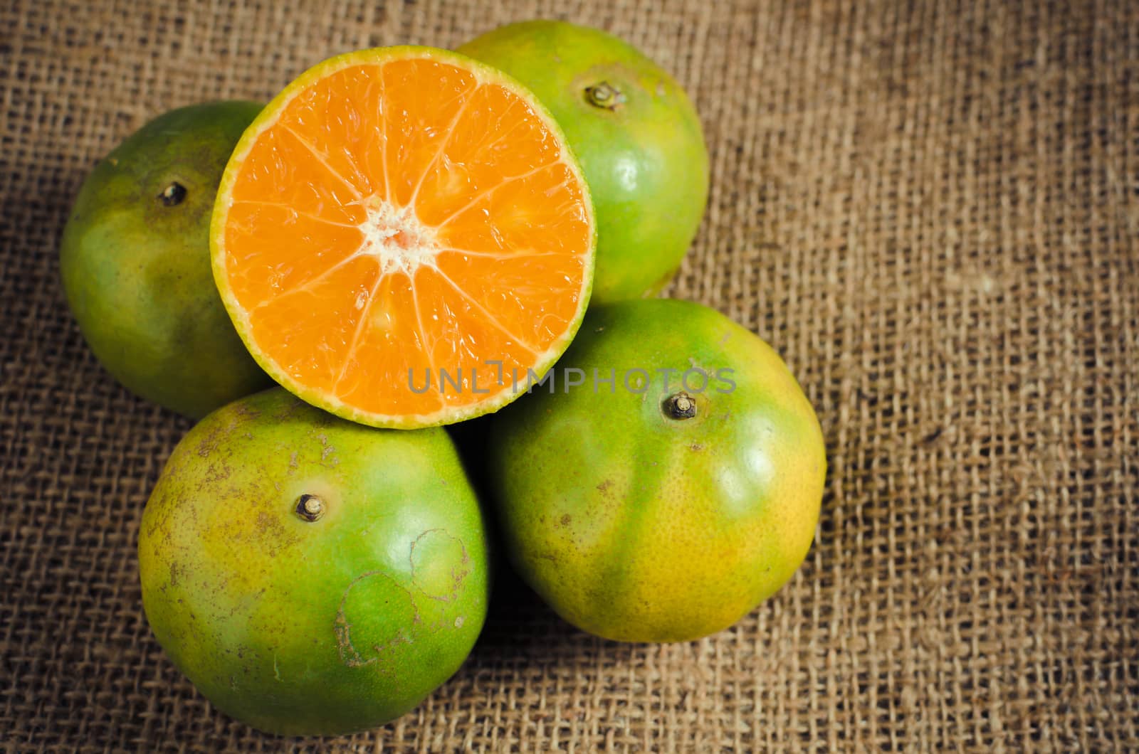 mandarin orange,Tangerines, sweet green thai orange on natural linen