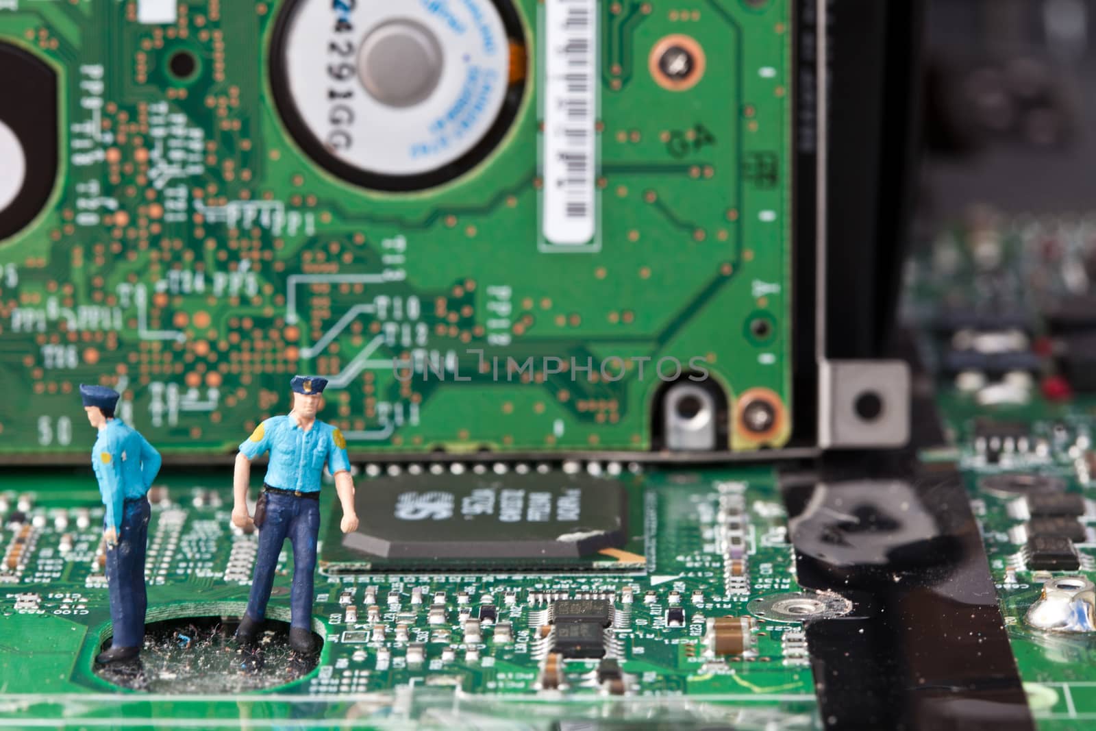 Macro picture of computer electronics with a policeman