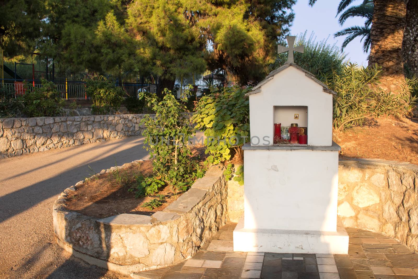 Memorial shrine, tradition in Greece. Situated by the road. Early evening sunlinght.