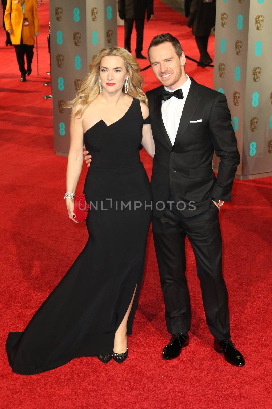 UK, London: British actress Kate Winslet poses with German-Irish actor Michael Fassbender on the red Carpet at the EE British Academy Film Awards, BAFTA Awards, at the Royal Opera House in London, England, on 14 February 2016.
