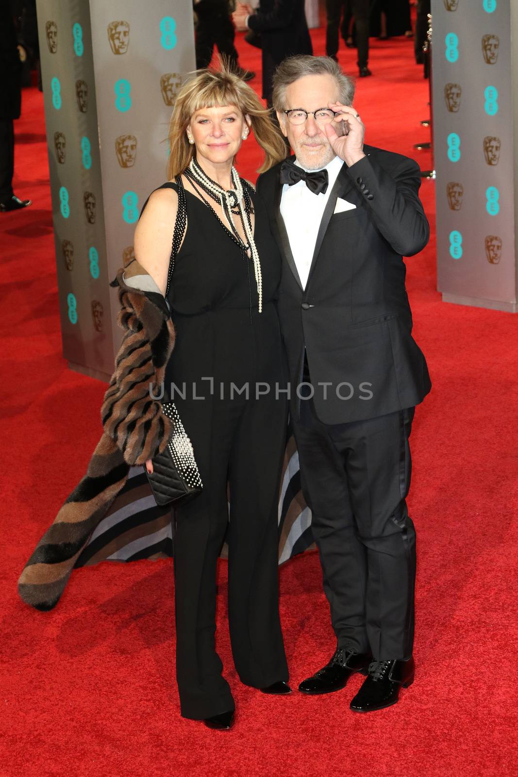 UK, London: American director Steven Spielberg poses with wife Kate Capshaw on the red Carpet at the EE British Academy Film Awards, BAFTA Awards, at the Royal Opera House in London, England, on 14 February 2016.