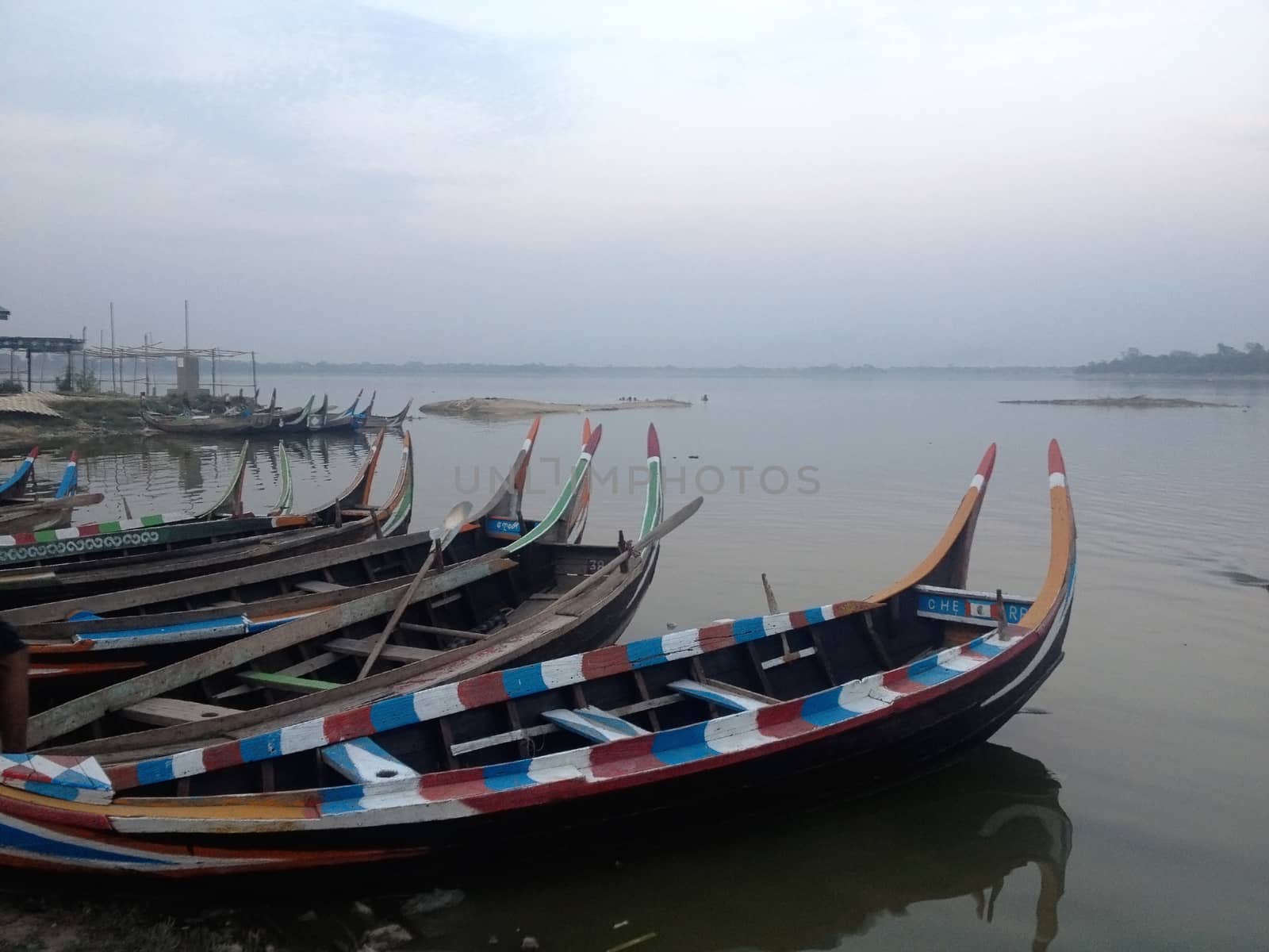 color boats beside taungthaman lake, mandalay, myanmar