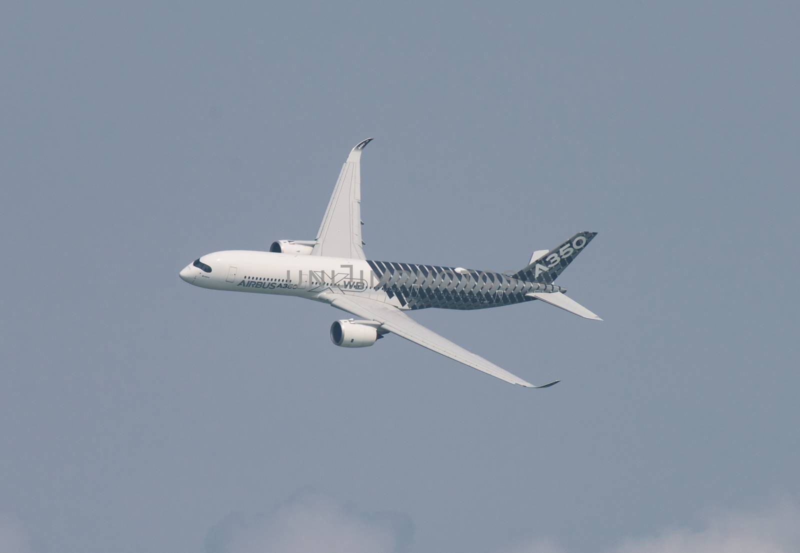 Singapore - February 14, 2016: Airbus A350 XWB during it’s performance at Singapore Airshow at Changi Exhibition Centre in Singapore.