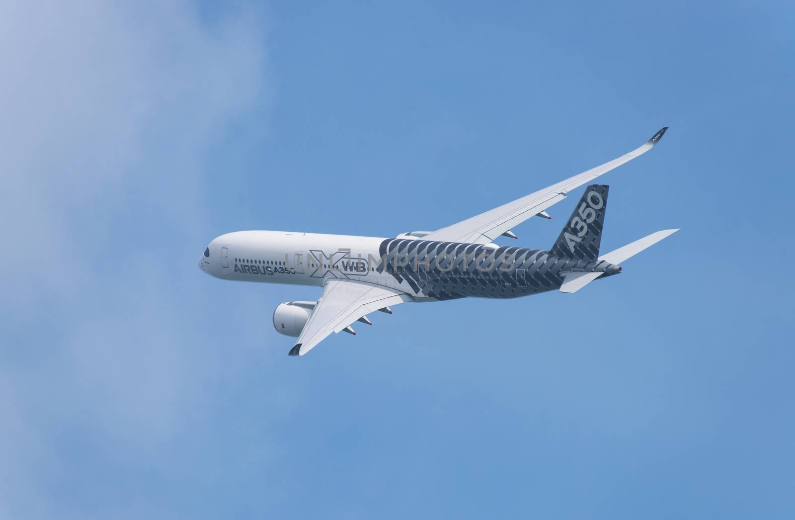 Singapore - February 14, 2016: Airbus A350 XWB during it’s performance at Singapore Airshow at Changi Exhibition Centre in Singapore.