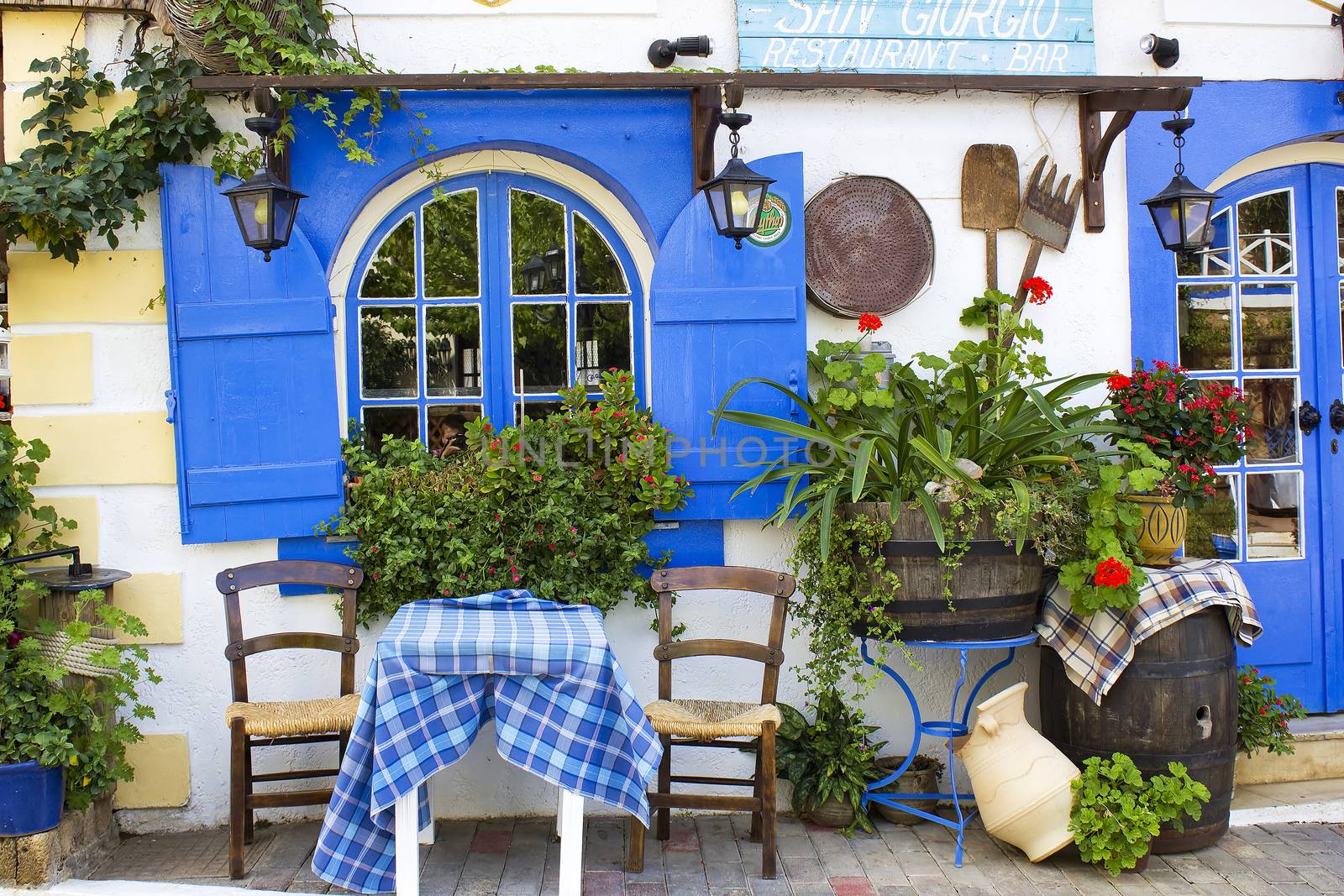 Table on the street outside Taverna in Malia, Crete by miradrozdowski