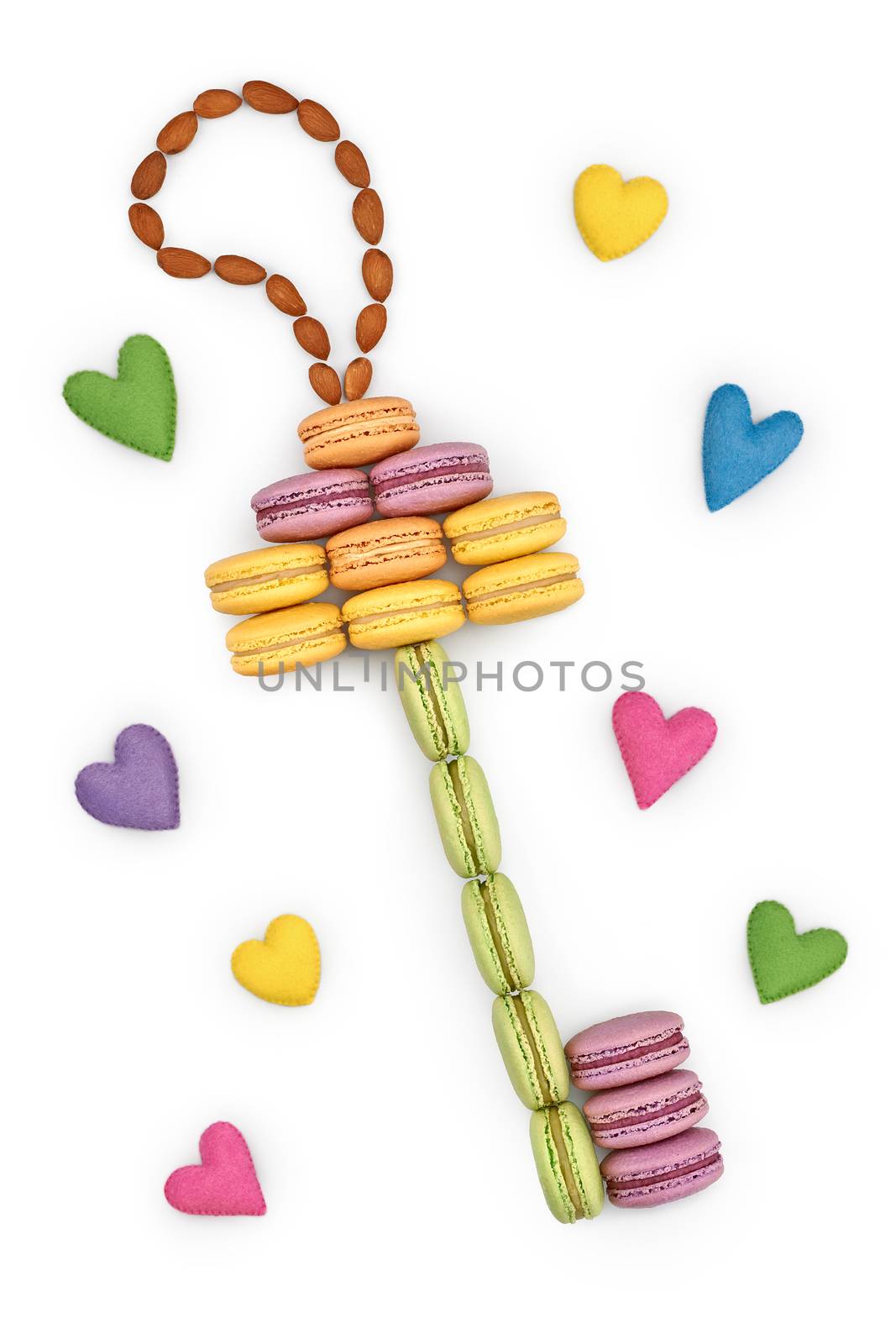 Macarons sweet colorful, key shape. Love, handmade hearts. French traditional delicious dessert, almond. Unusual creative romantic still life. Concept for love story. Valentines Day. Isolated