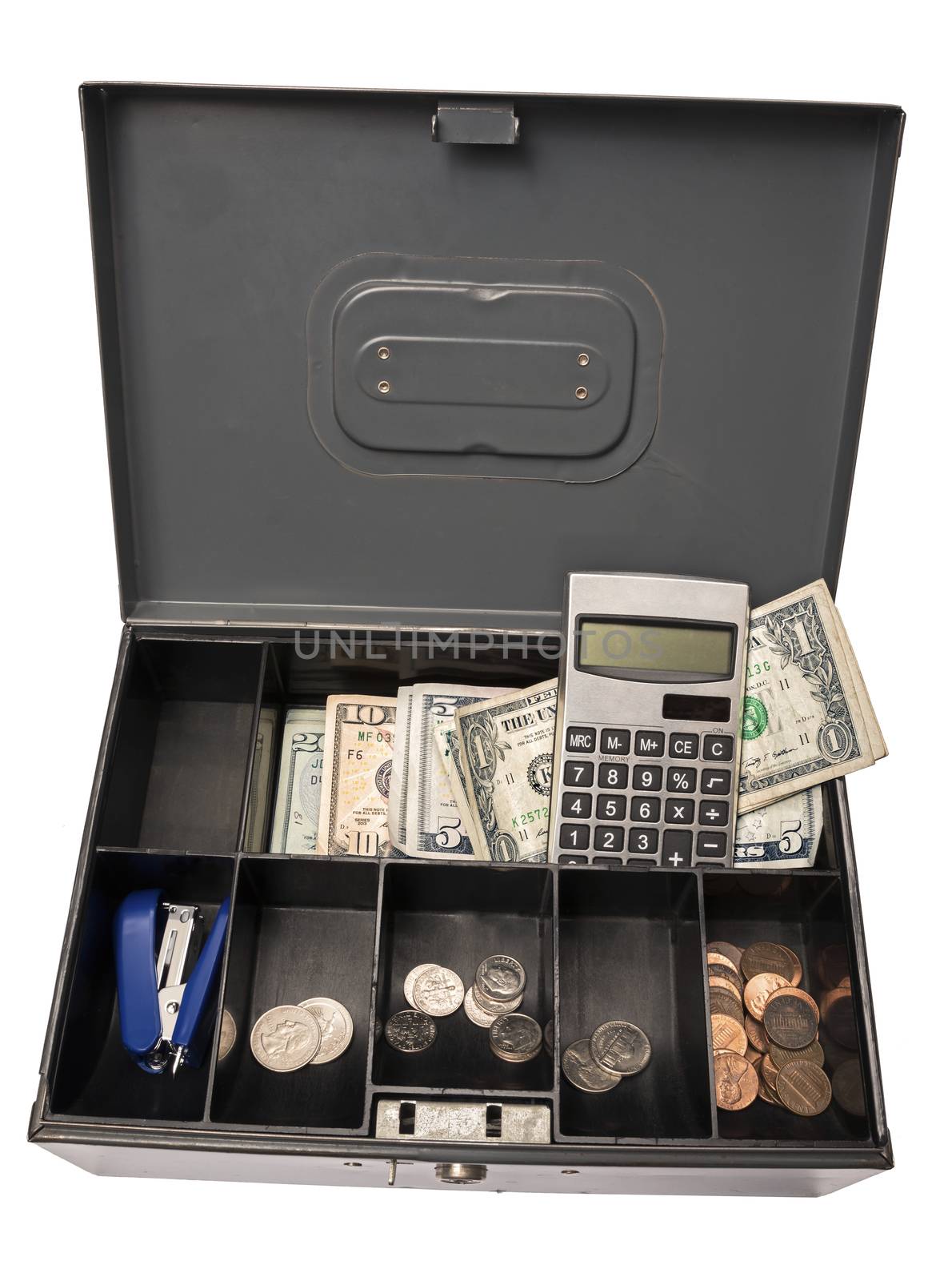 Old cash box holding cash, coins, calculator, and a stapler.