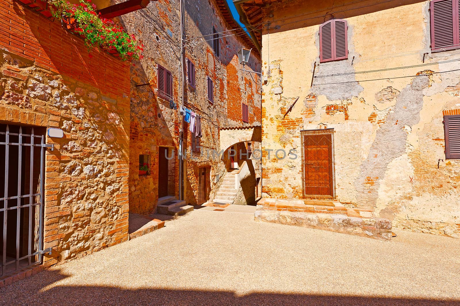 Narrow Street with Old Buildings in Italian City