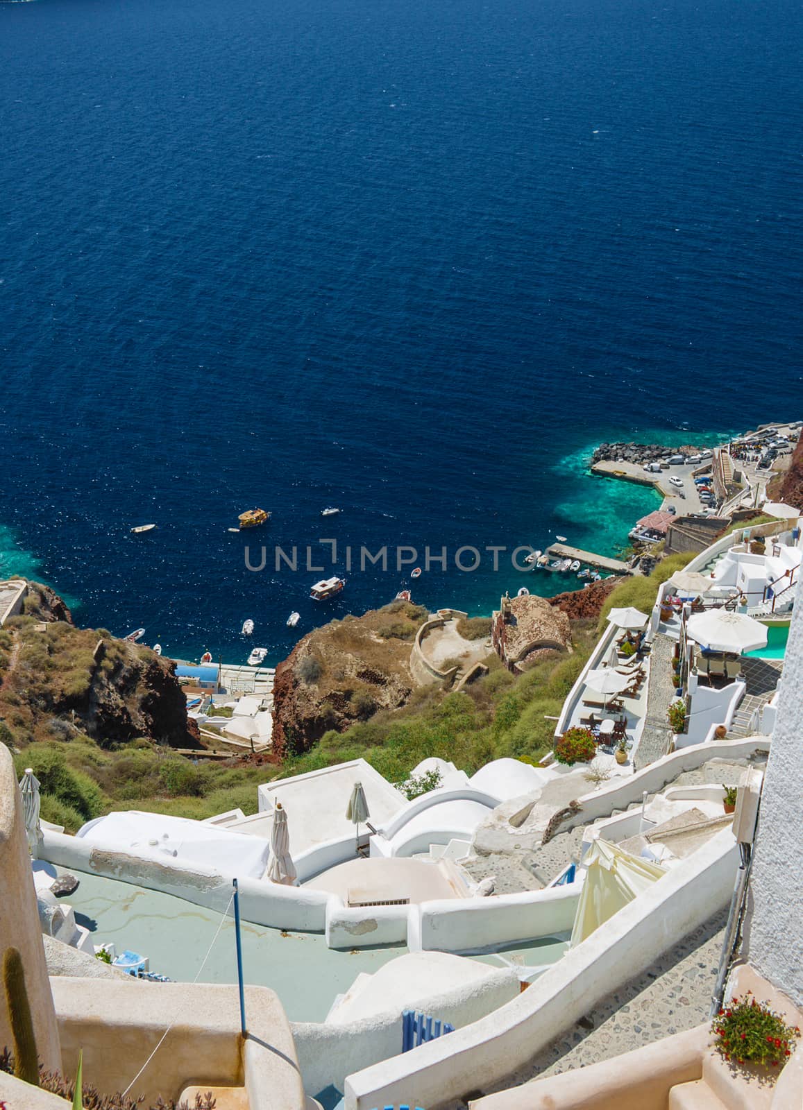 View from the top of a cliff on the town Oia and the sea on the island of Santorini, Greece