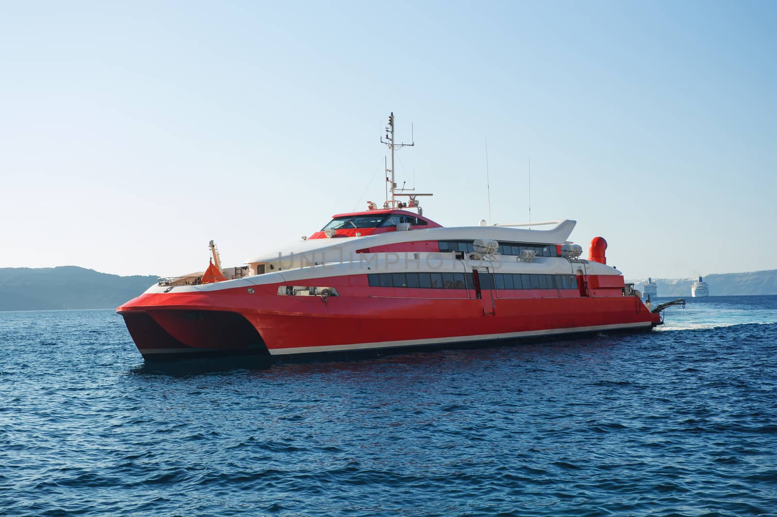 Speed red ferry boat on Santorini, Greece