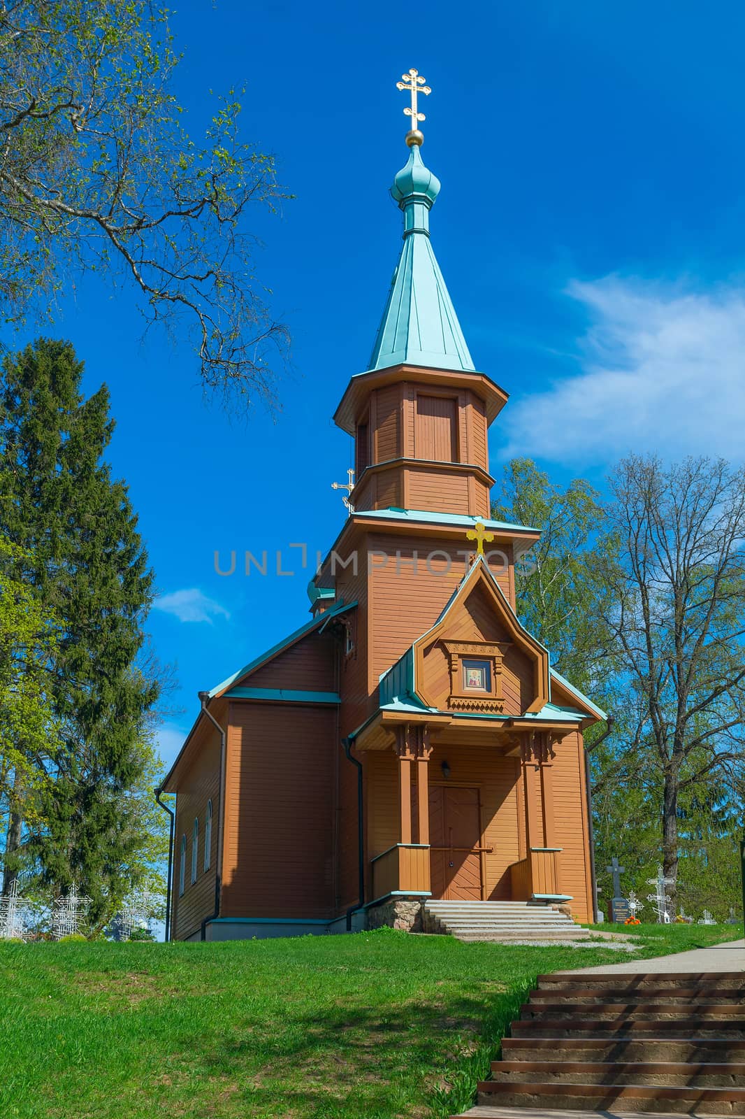 Wooden rural Orthodox church in the spring sunny day by BIG_TAU