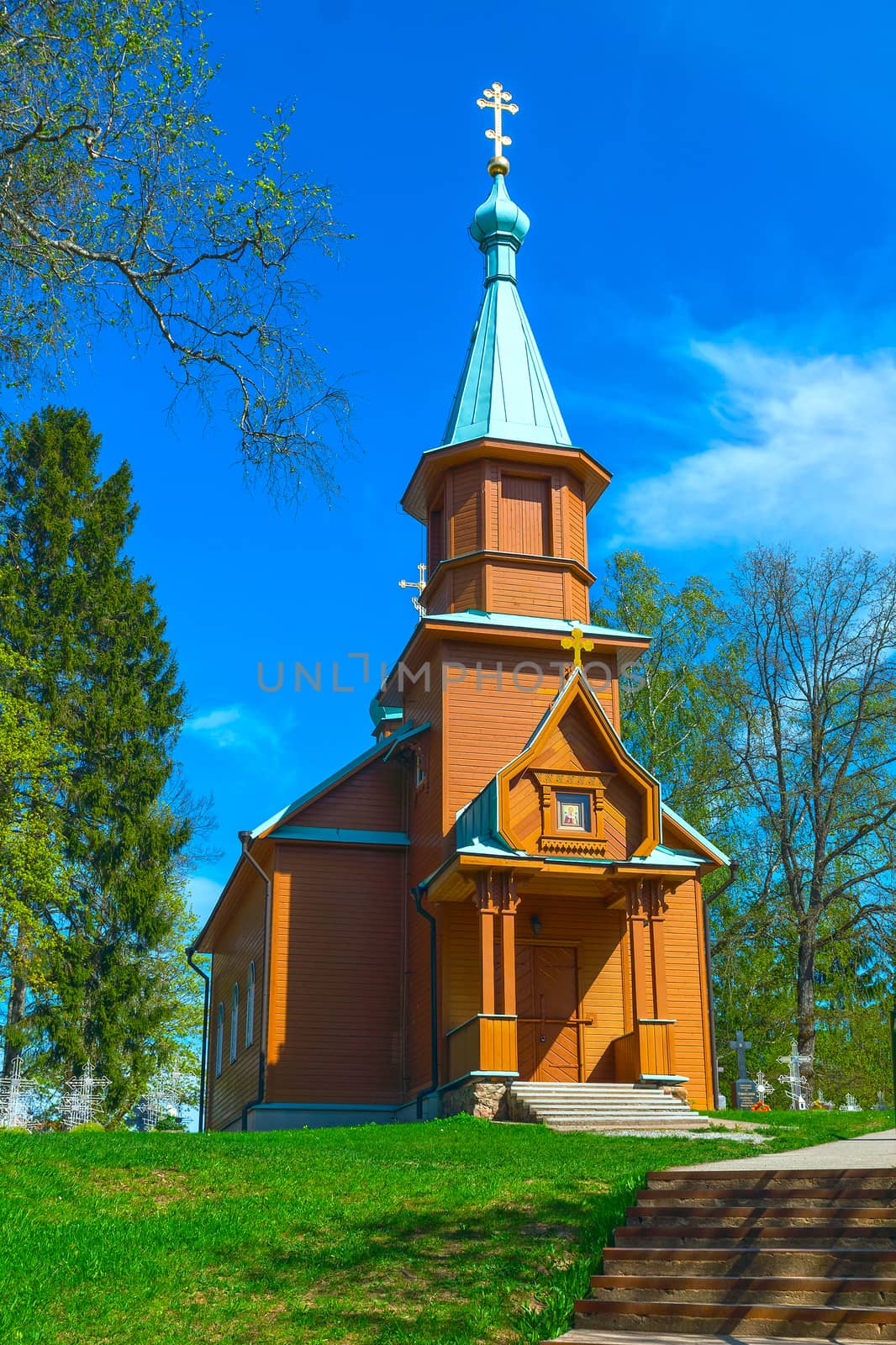 Wooden rural Orthodox church in the spring sunny day by BIG_TAU