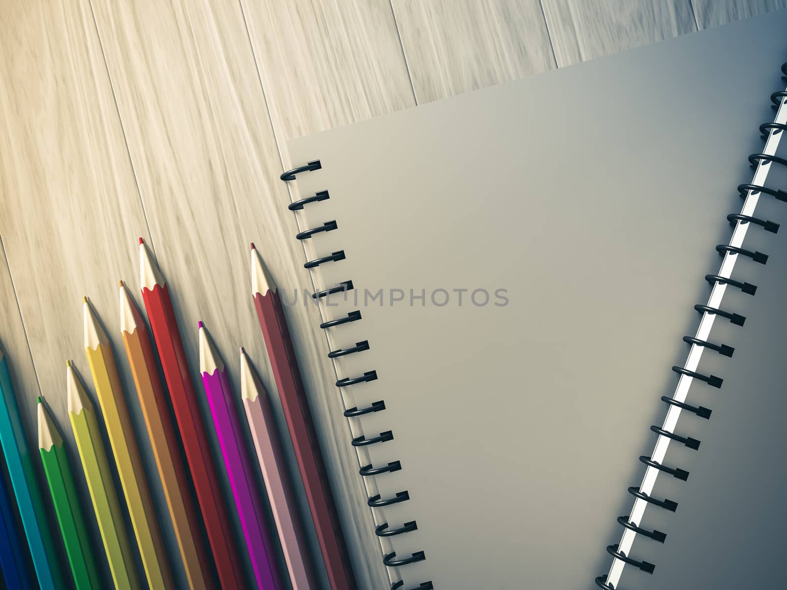 color pencil on checked notebook on wood background, stationary object