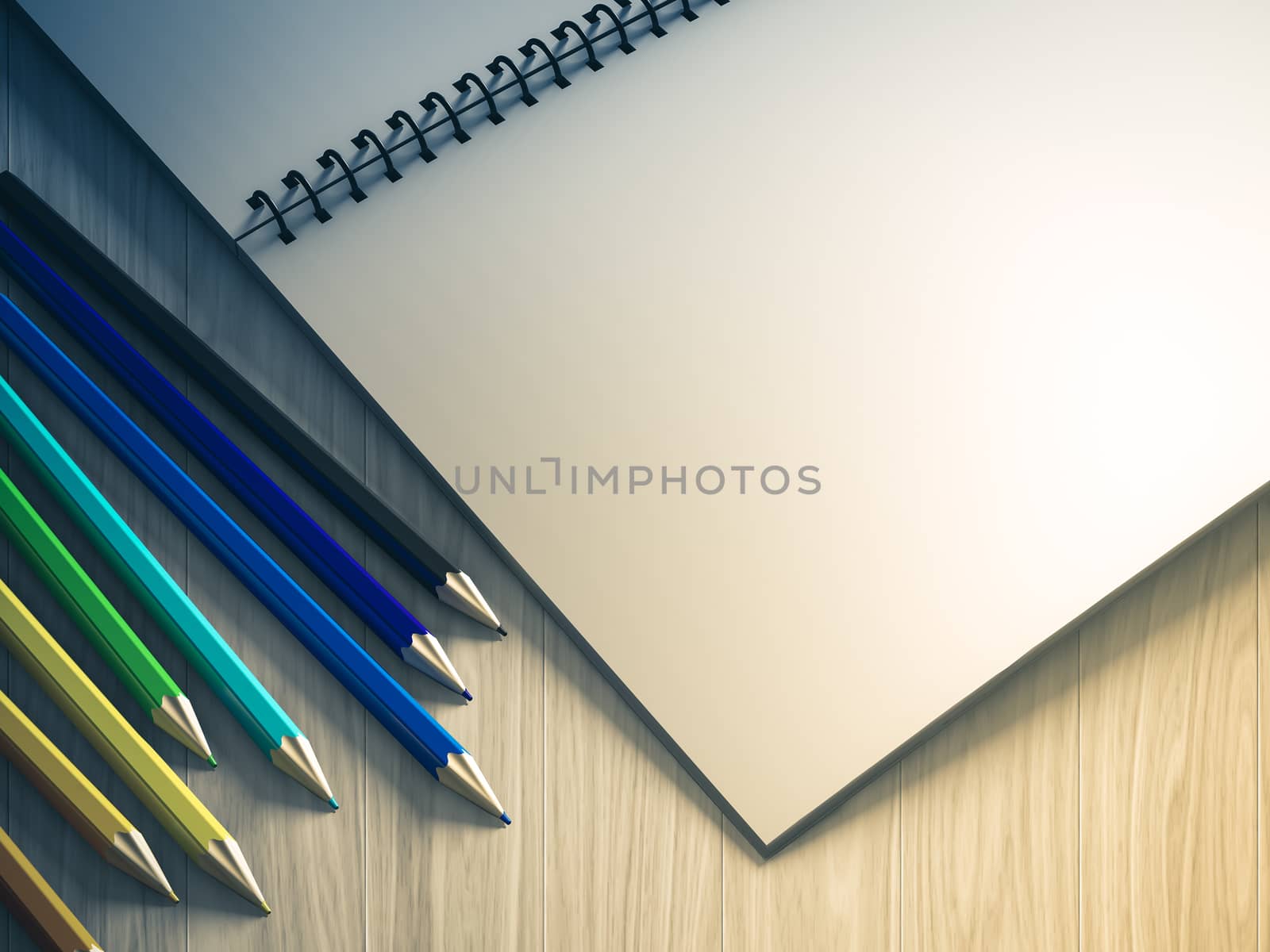 color pencil on checked notebook on wood background, stationary object