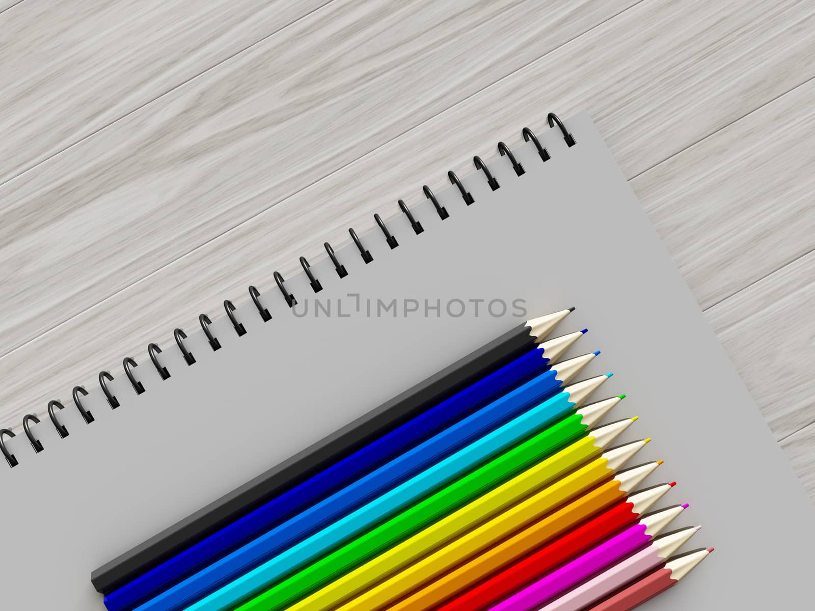 color pencil on checked notebook on wood background by teerawit