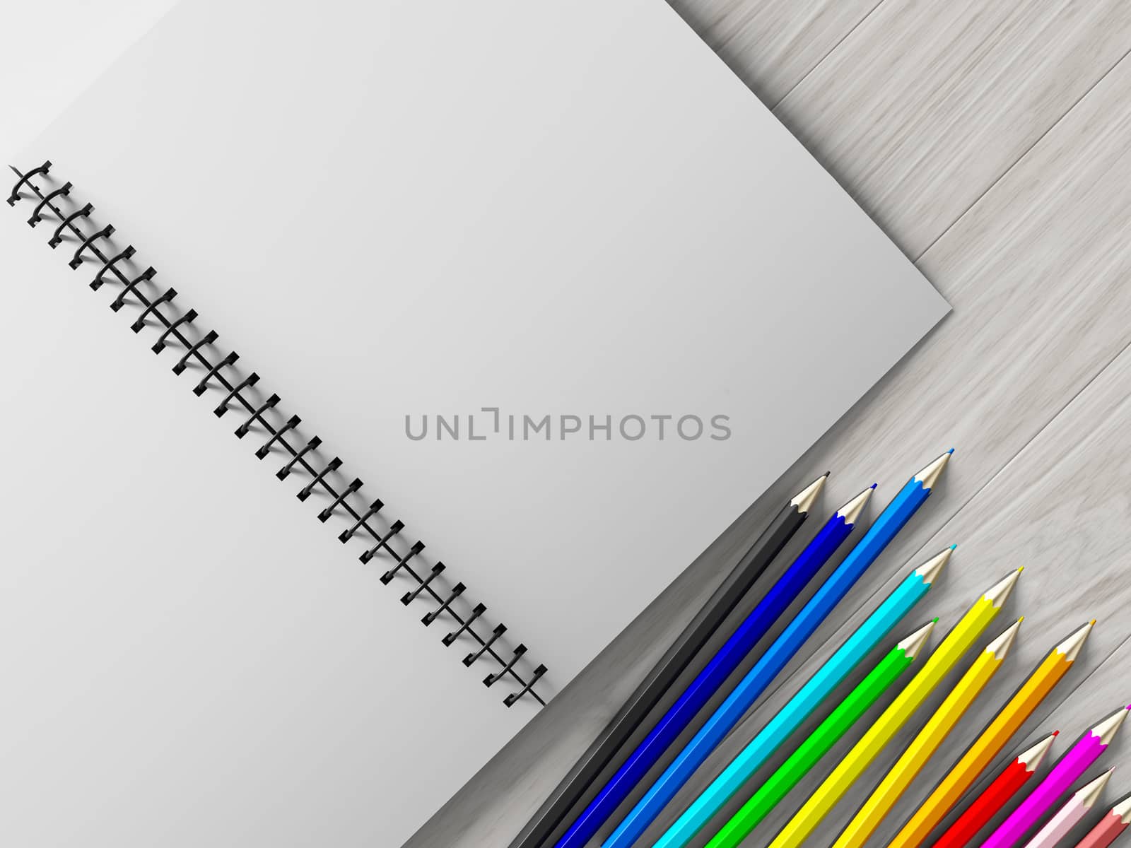 color pencil on checked notebook on wood background by teerawit