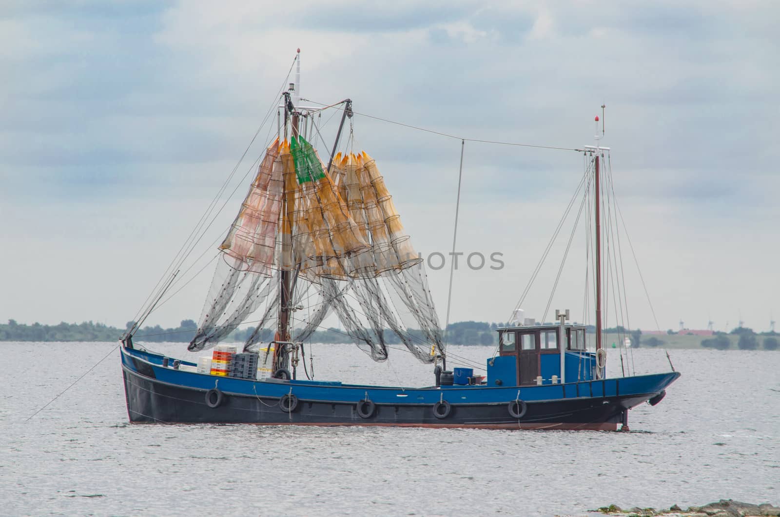 Fishing boat on the Grevelingenmeer in Holland. Shot at dusk.