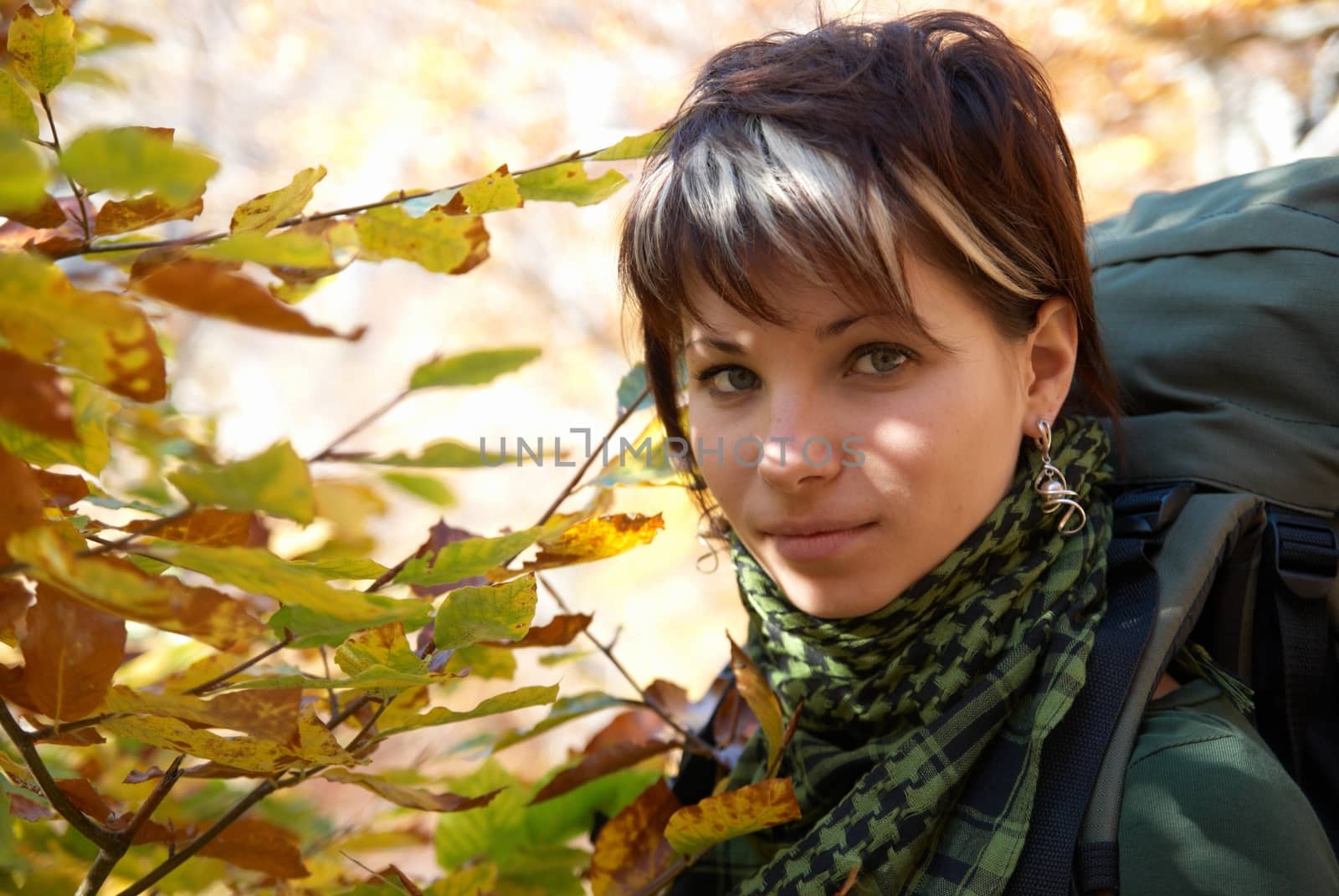 Beautiful girl's portrait with soft autumn background