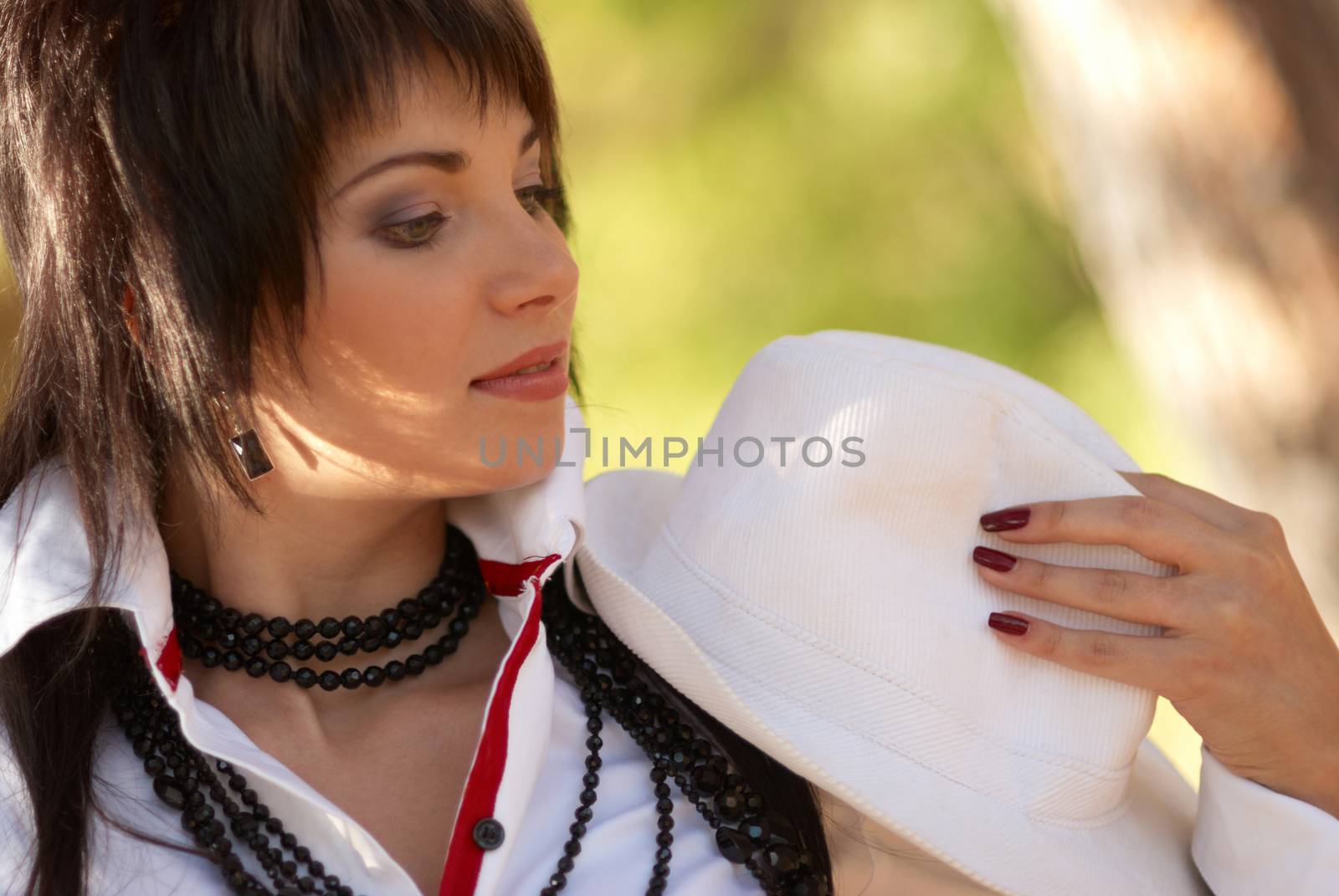 Beautiful girl in the white hat by vapi