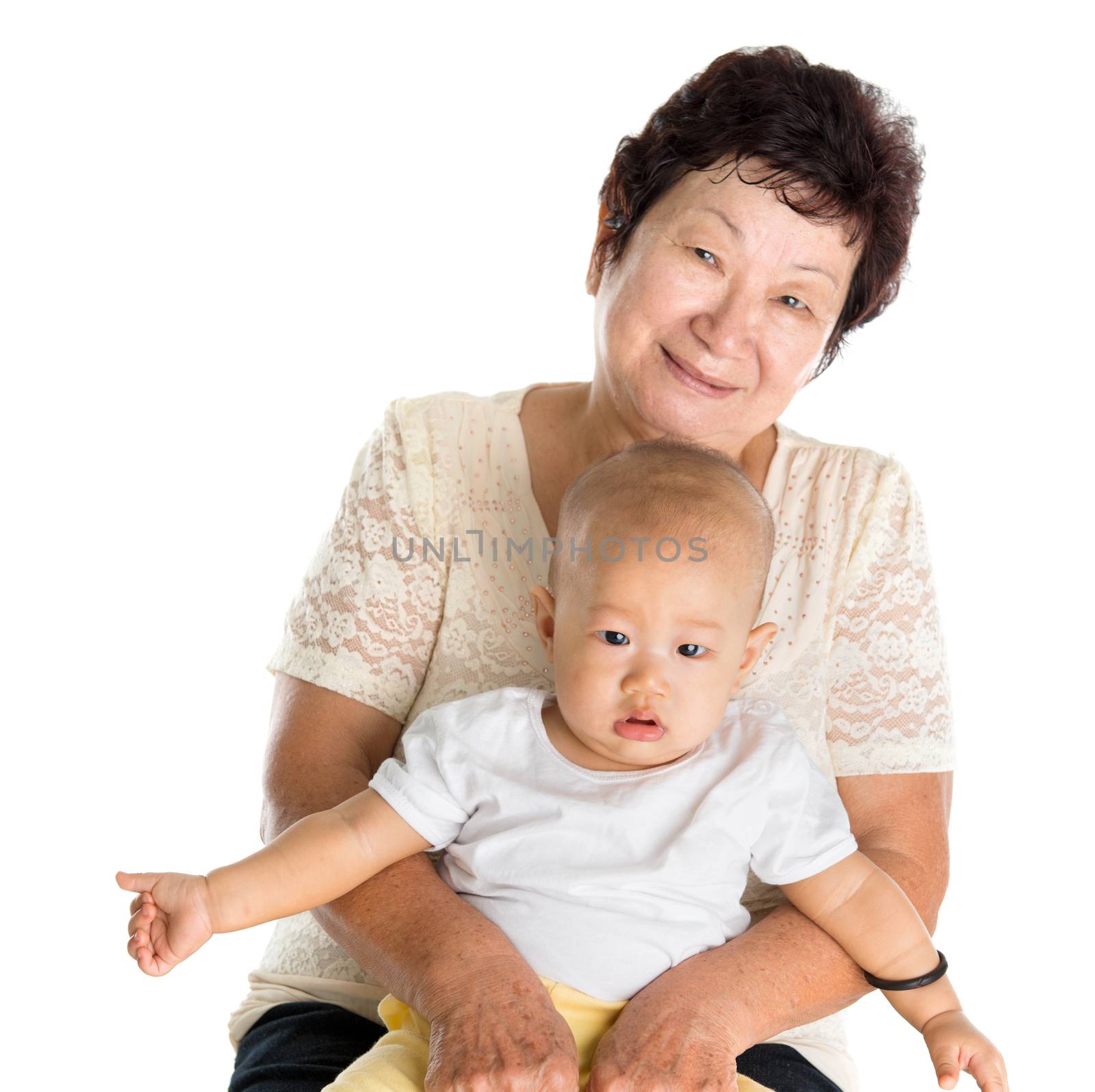 Portrait of Asian grandmother and grandson, isolated on white background.