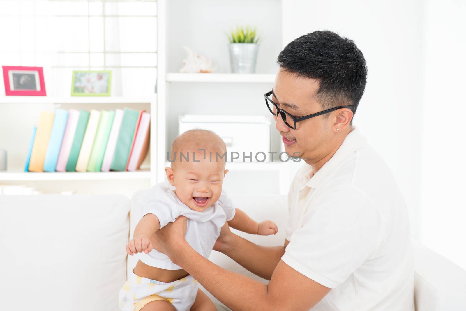 Father and baby boy playing by szefei