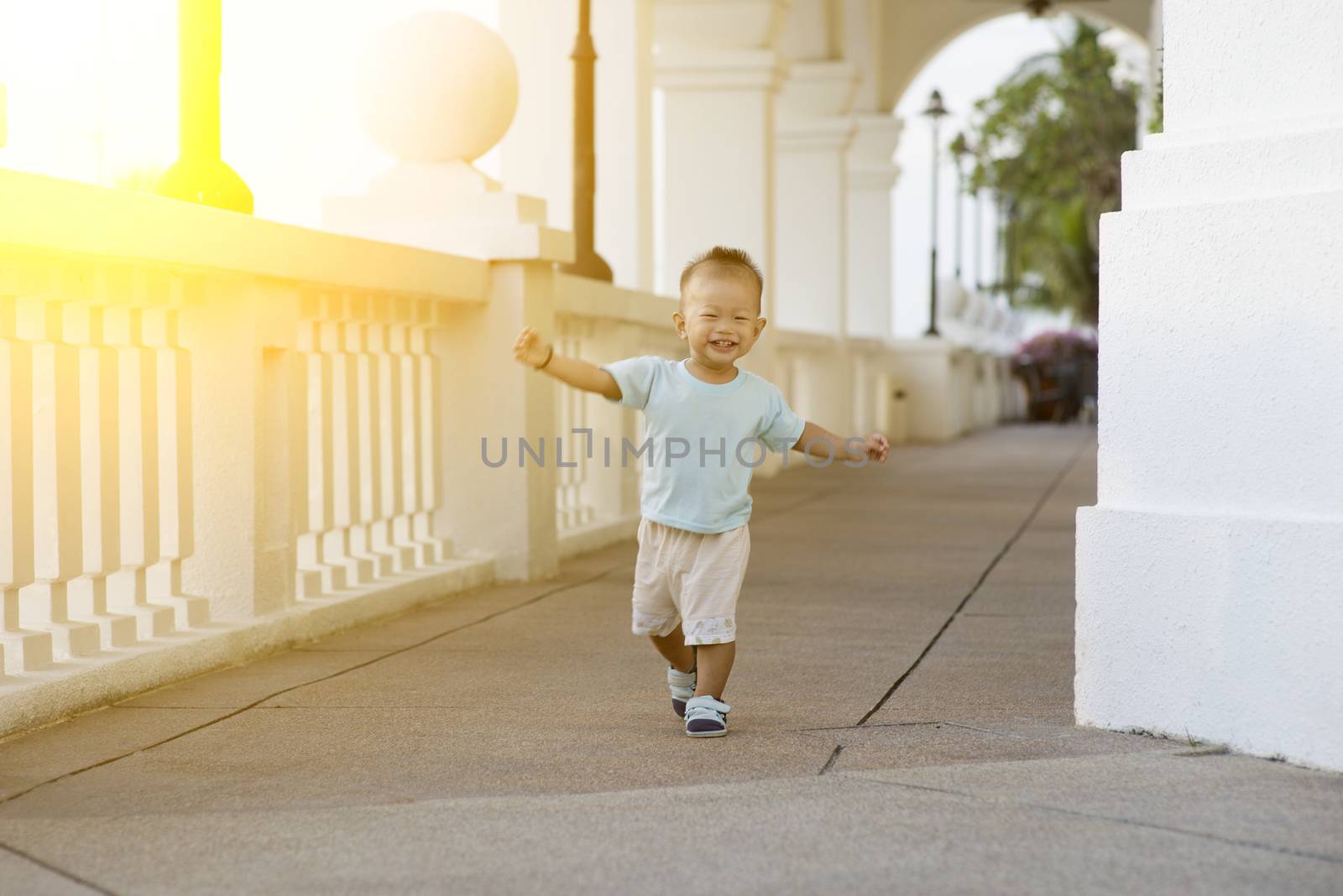 Asian toddler running at outdoor by szefei