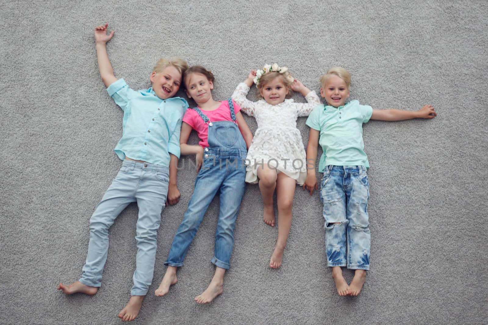 Kids laying on floor by ALotOfPeople