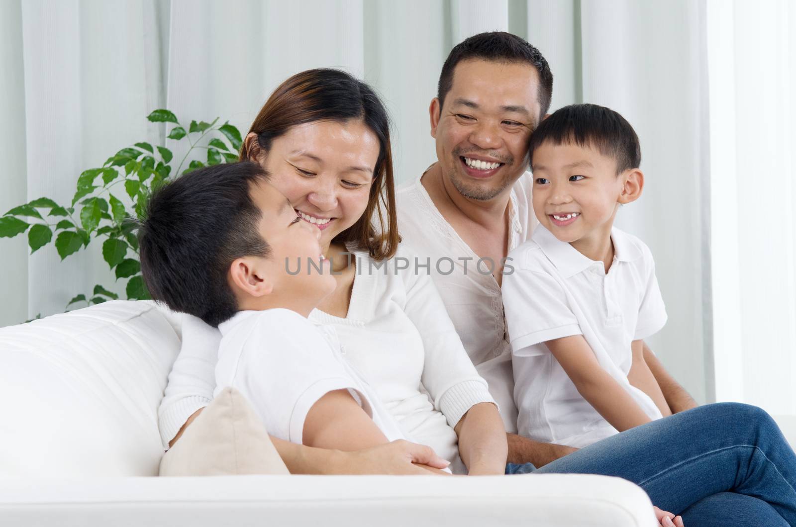 Asian family having conversation at home