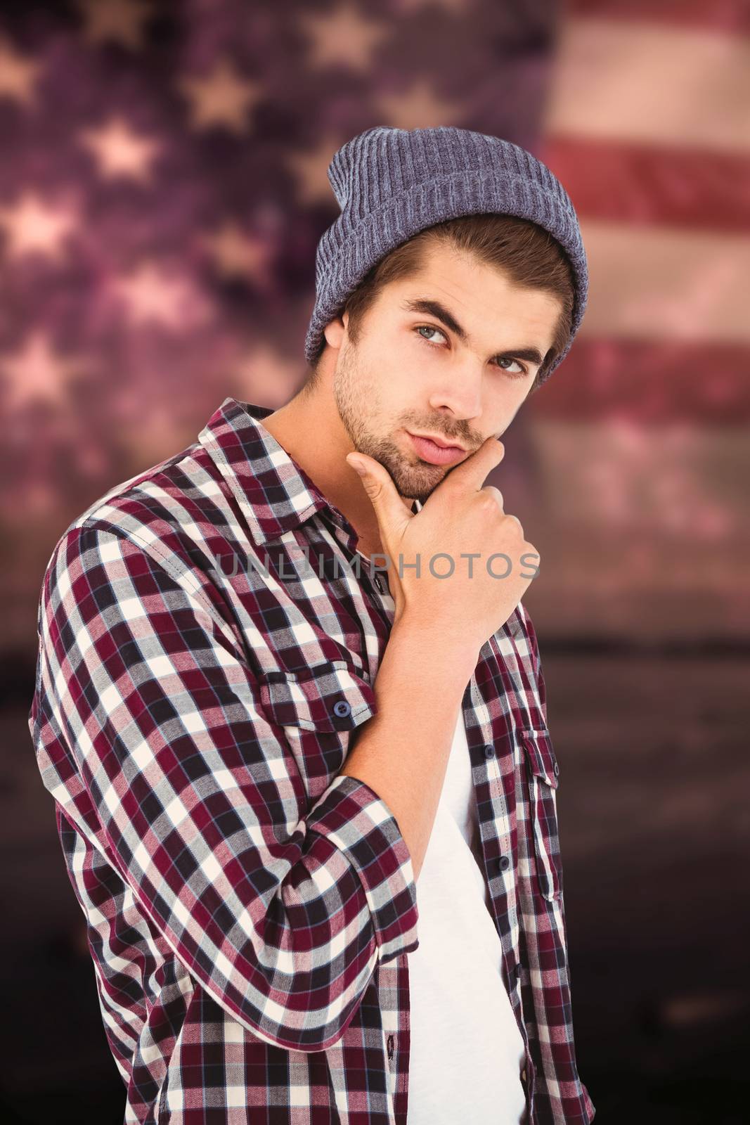 Thoughtful man against white background against composite image of colourful fireworks exploding on black background