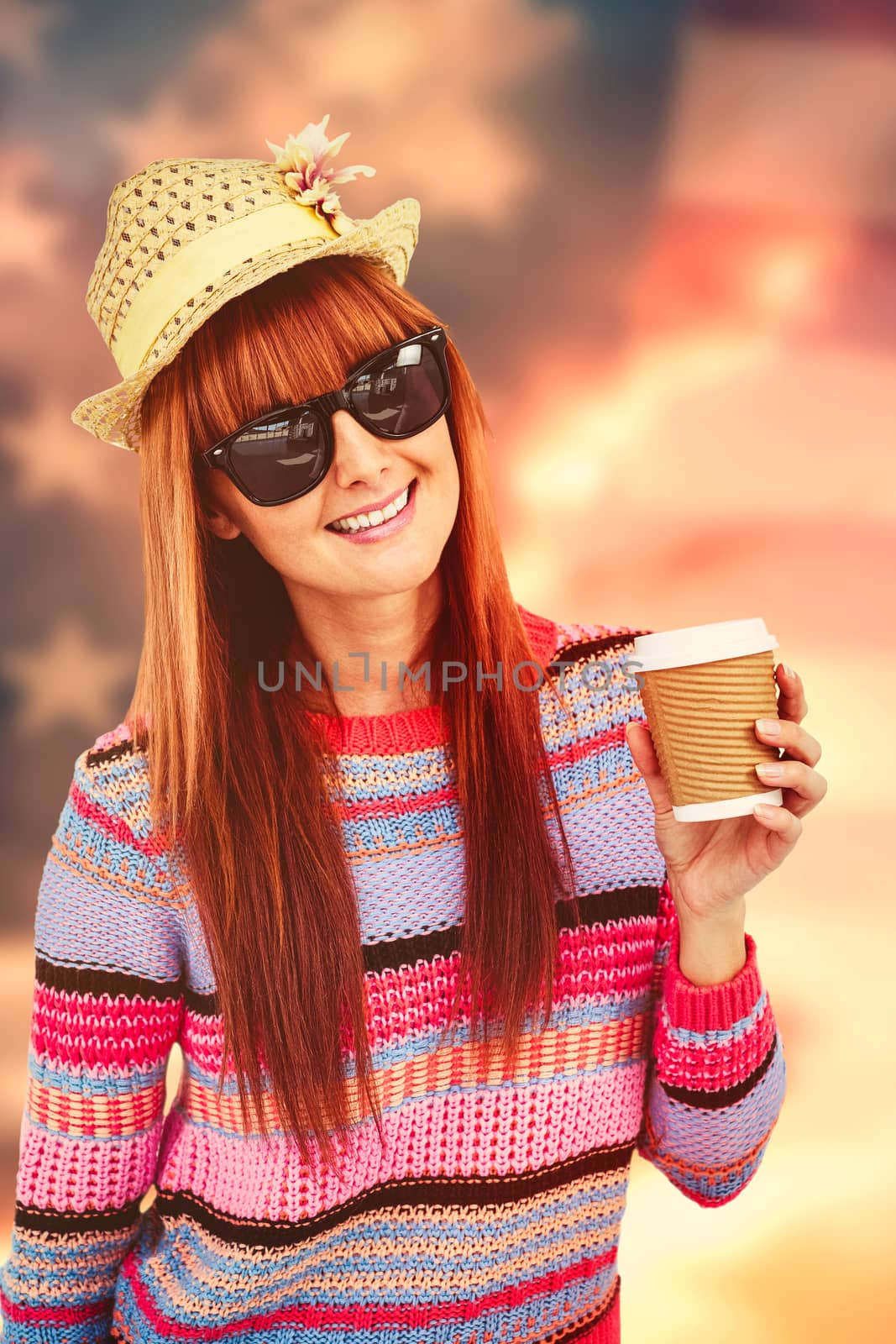 Attractive hipster woman holding a cup of coffee against composite image of united states of america flag